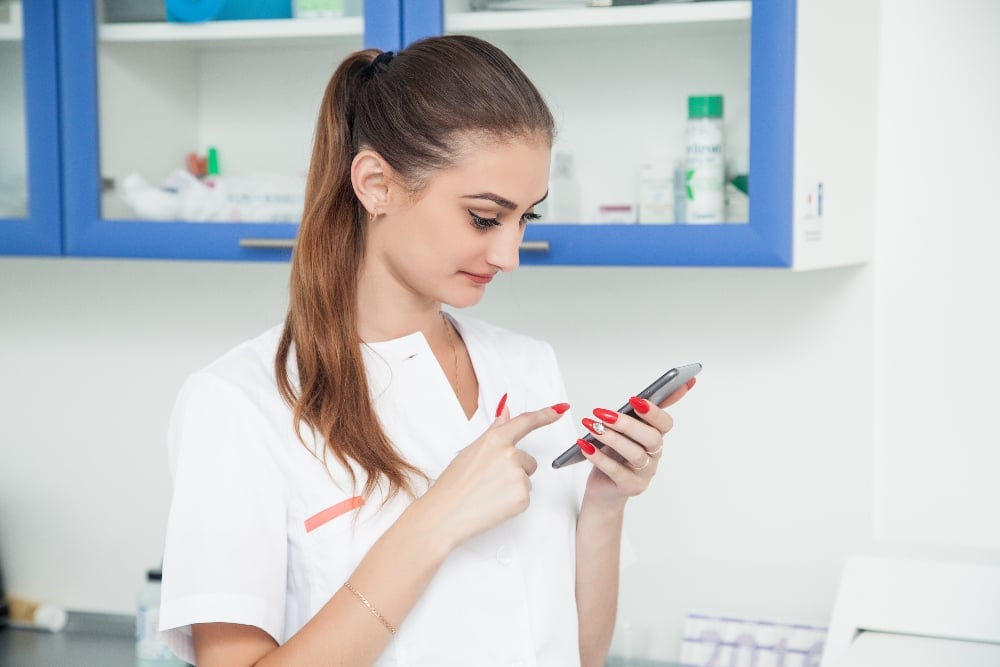 Dentist texting patients