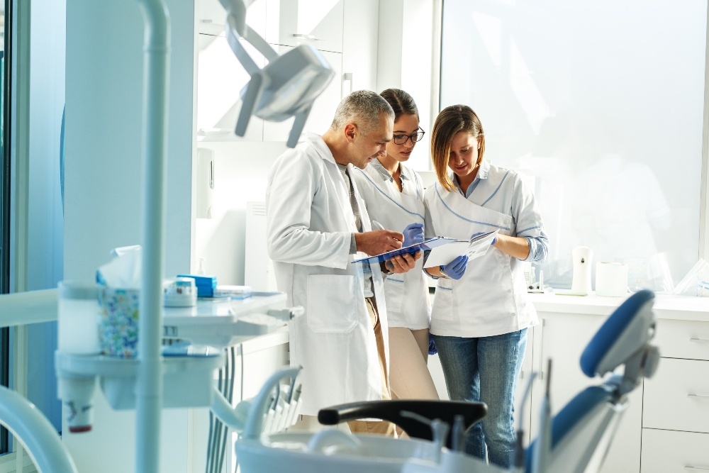 Dentists reviewing paper work